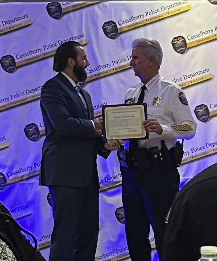 Receiving commendation from the Chief of Police